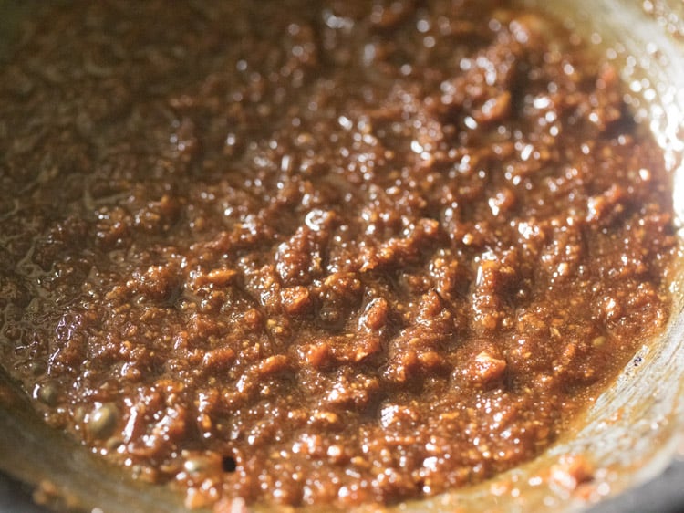 cooking coconut-jaggery mixture for making kolukattai. 