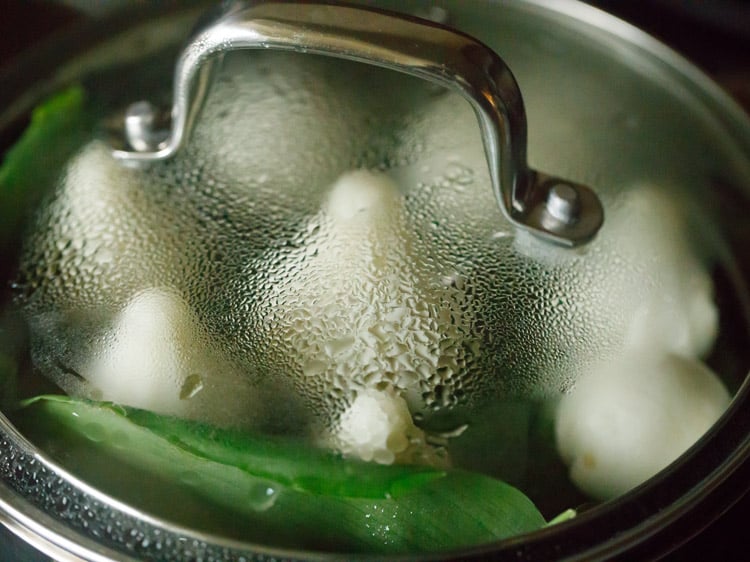 steaming kozhukattai in covered pot. 