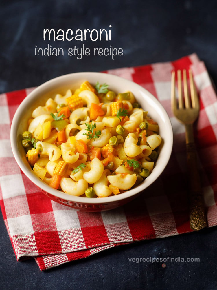 macaroni in a bowl on a red checkered napkin with fork at right side.