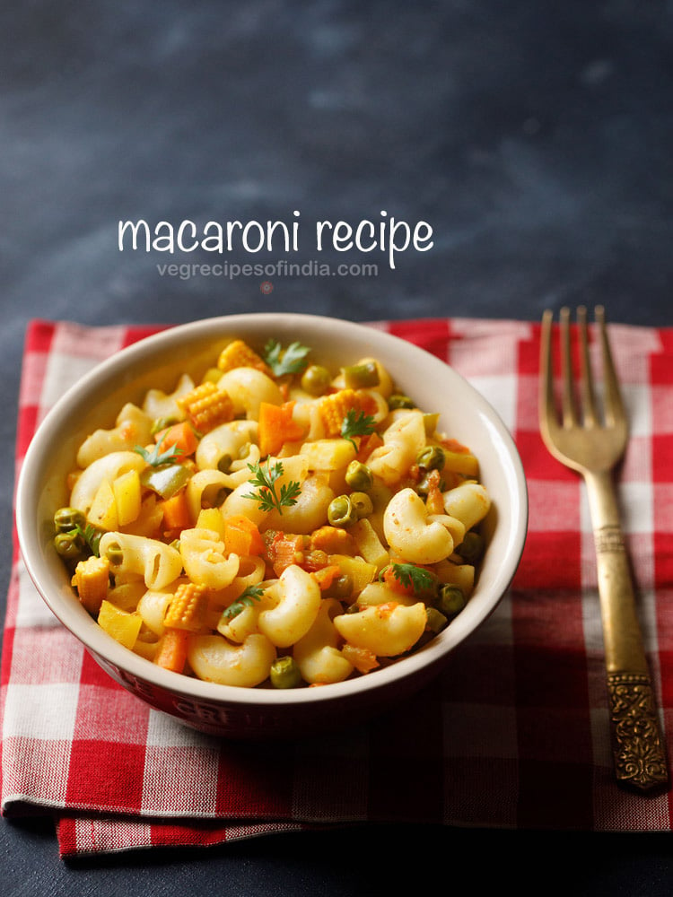 Indian style macaroni pasta in a bowl on a red checkered napkin with fork at right side.