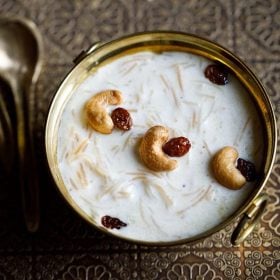 semiya payasam garnished with cashews and raisins in a brass bowl