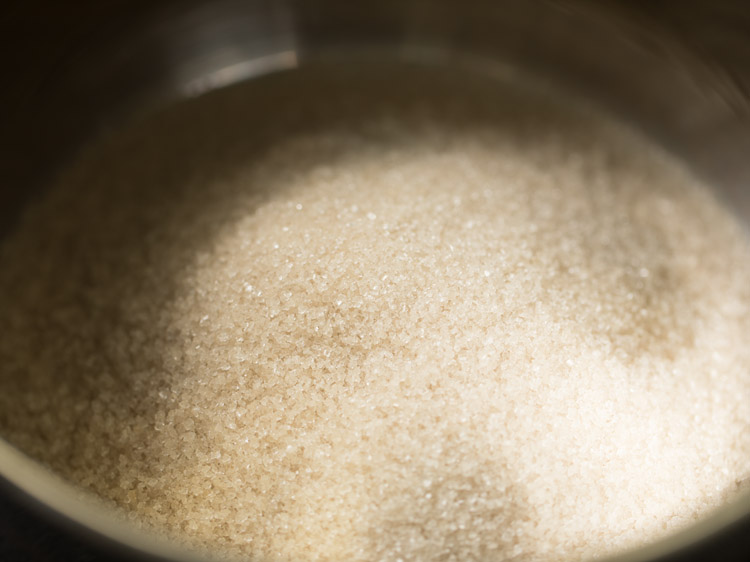 sugar added to a large pan for making sugar syrup for cham cham sweet. 