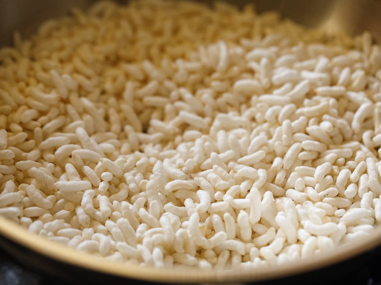 roasting puffed rice or mandakki in coconut oil in a pan. 