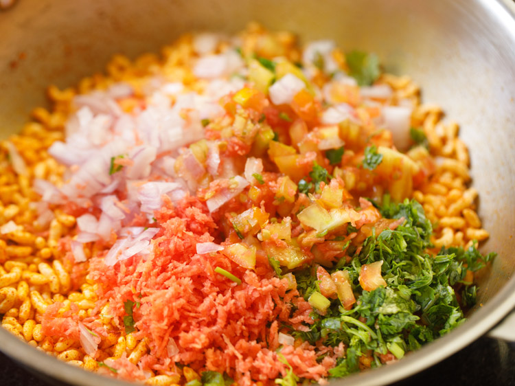 finely chopped vegetables and grated carrots added to the puffed rice mixture. 