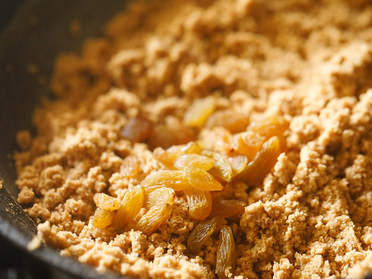 raisins and cardamom powder added to roasted wheat flour. 