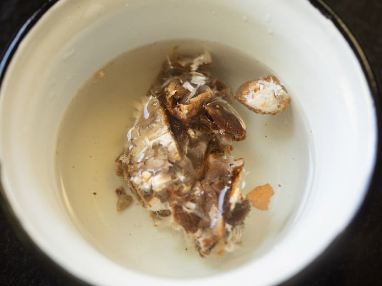 tamarind in water in a bowl