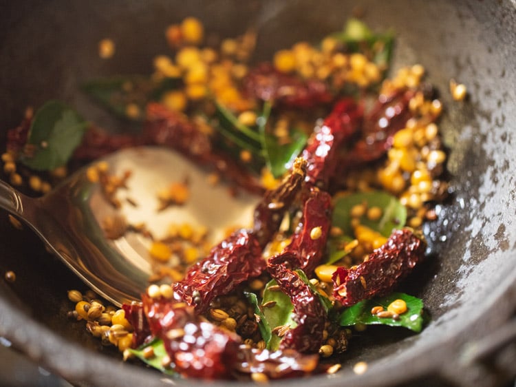 mixing and roasting spices in the pan