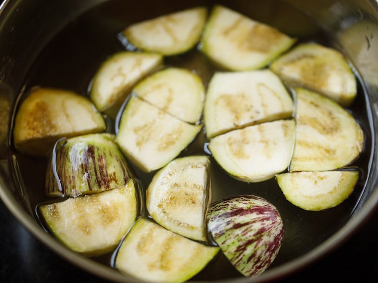 chopped brinjal in a pan with water