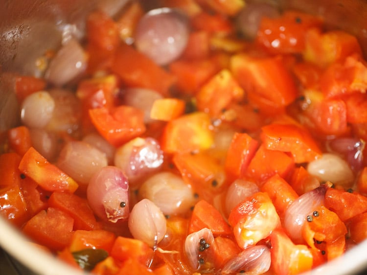 sauteing tomatoes in the pan