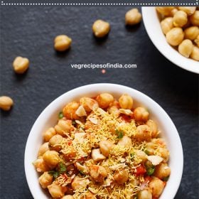 chana chaat served in a white bowl.