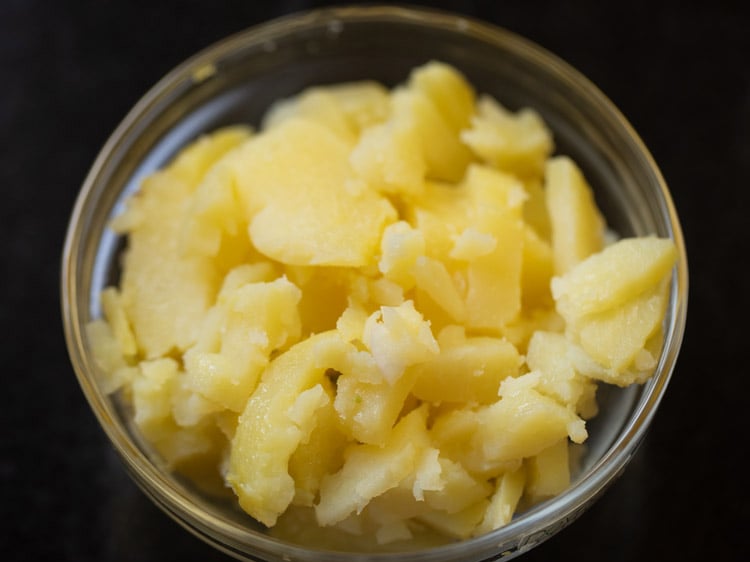 peeling and chopping boiled potato