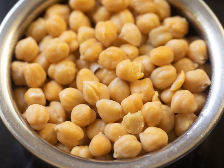draining cooked chana in a strainer or colander