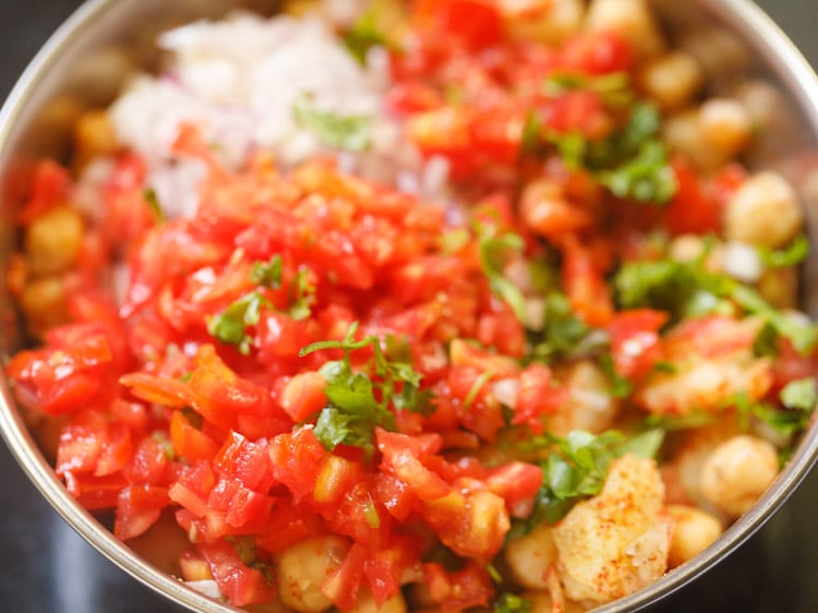 added onions, tomatoes, green chillies, coriander leaves to chana chaat mixture