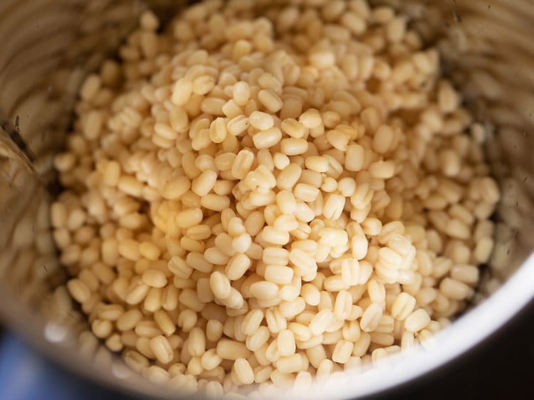 drained urad dal added to grinder jar. 