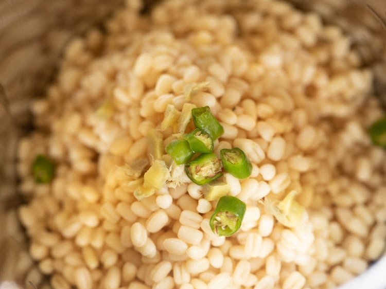 chopped ginger and chopped green chili added to urad dal. 