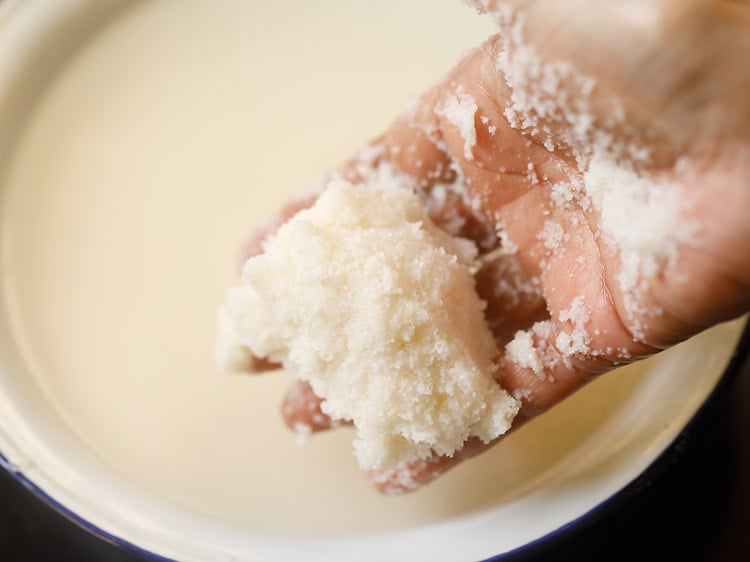 squeezing water out of rice rava. 