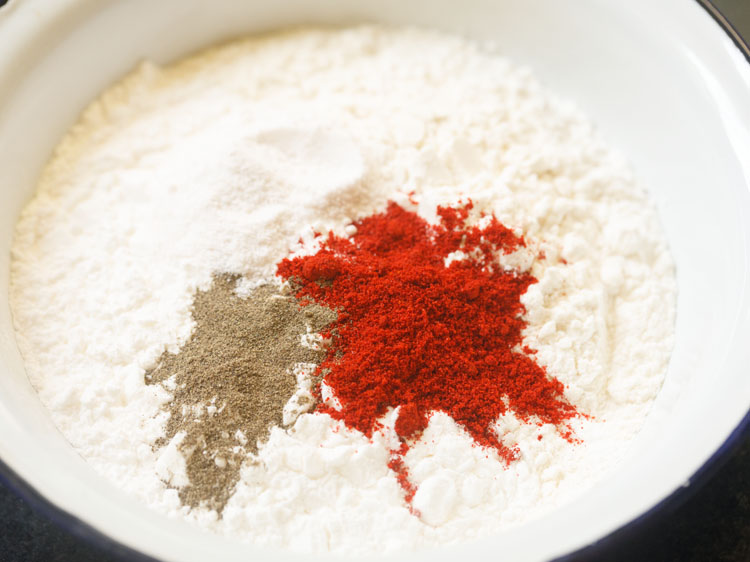 added kashmiri red chilli powder and black pepper powder