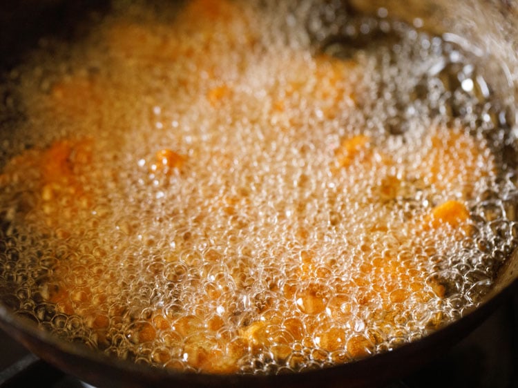 frying cauliflower florets till crisp and golden