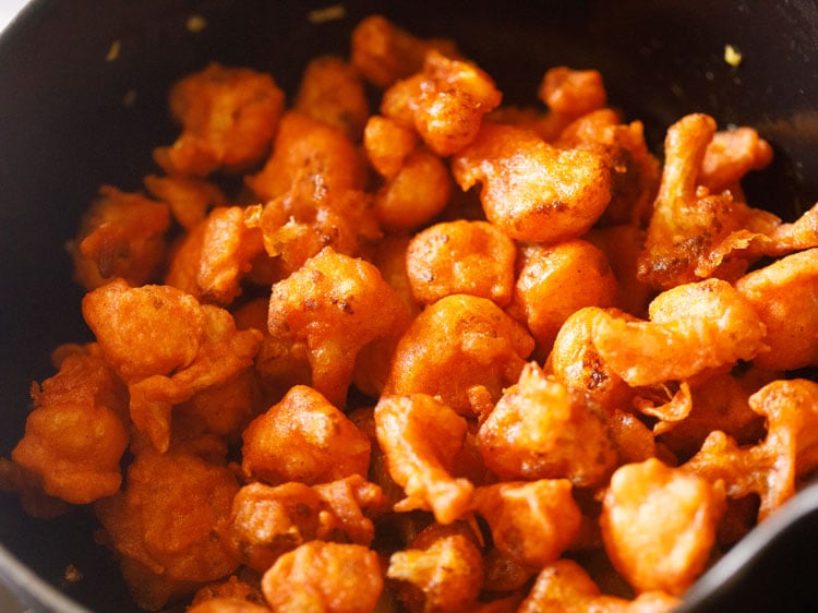 adding the fried cauliflower florets