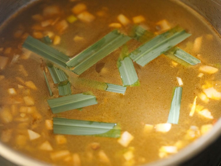 adding chopped green lemon grass stalk.