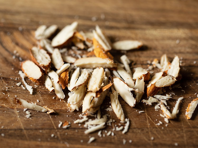 Chopped almonds on a cutting board.