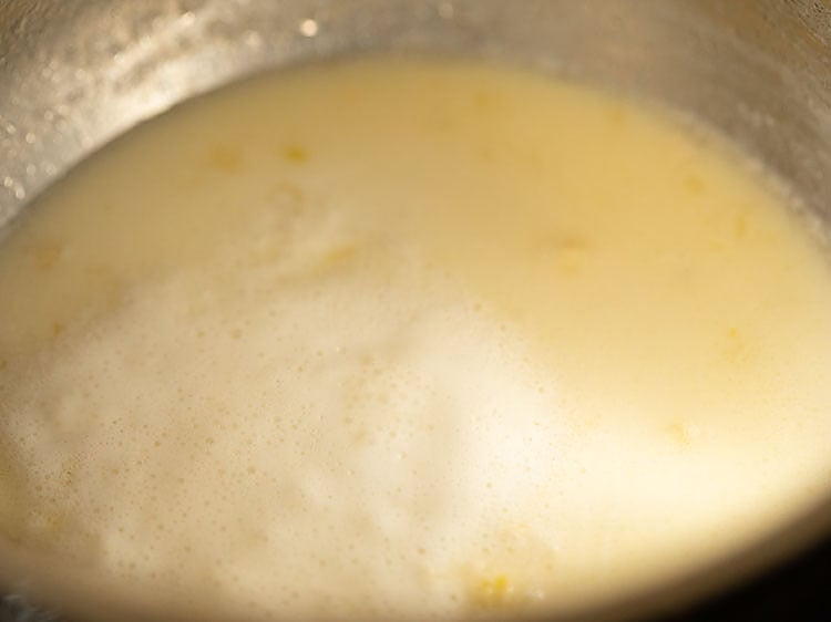 milk, butter and garlic mixture coming to a boil