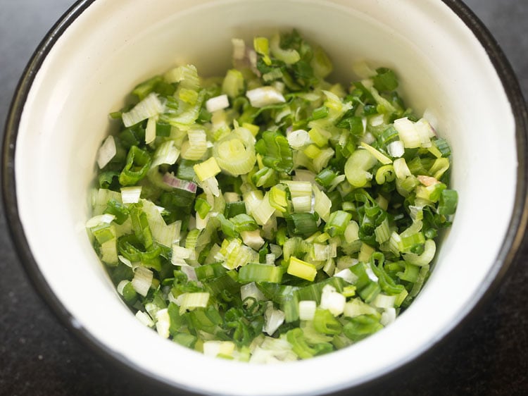 finely chopped scallions in a bowl.