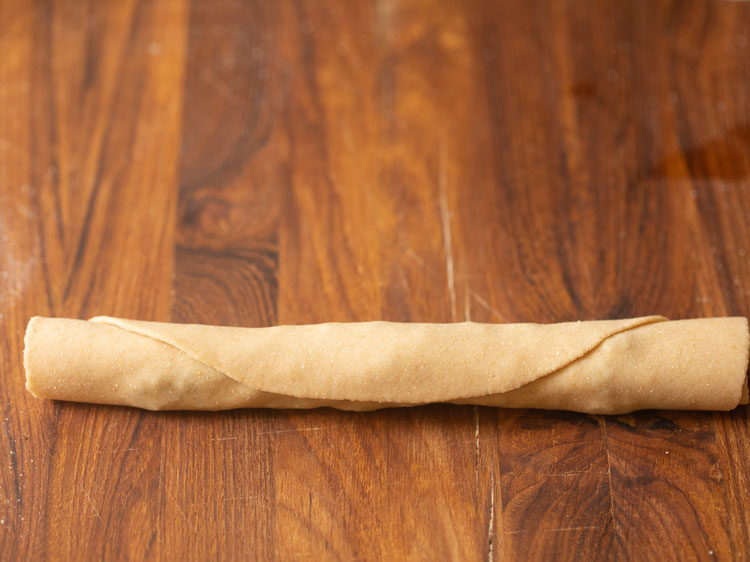 dough with the stuffing rolled tightly into a cigar shape.