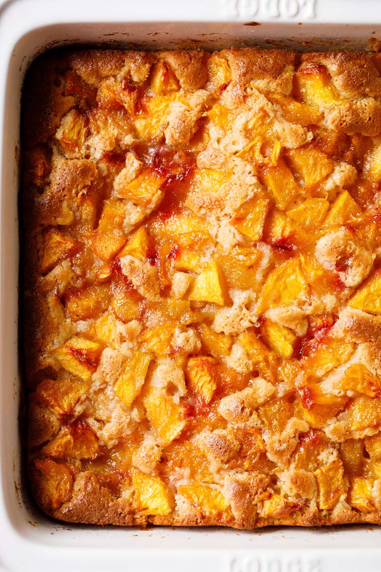 overhead shot of easy peach cobbler in the baking pan. 