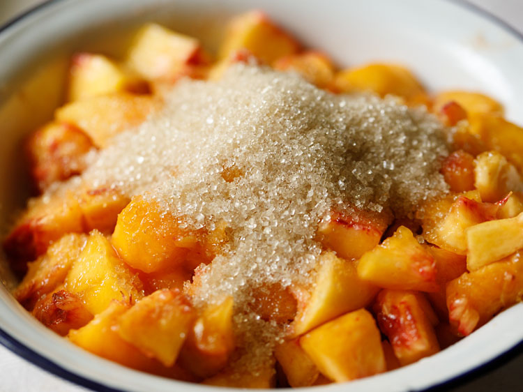 peaches and sugar added to mixing bowl.