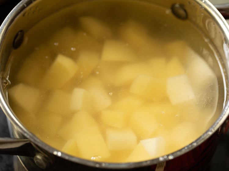 chopped potatoes added in the pan with water.