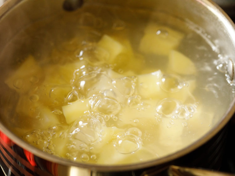 checking on potatoes when being boiled.