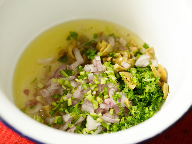 chopped onions, olives, celery and parsley added into the bowl for mayo dressing.