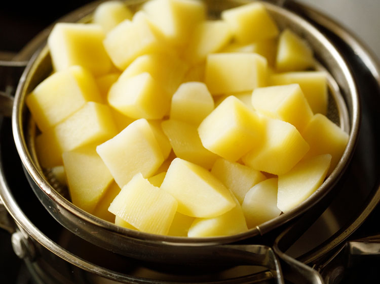 potatoes in a strainer.