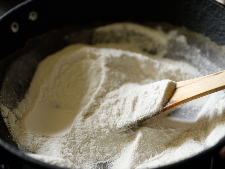 roasting rice flour, stirring often, for thattai recipe. 