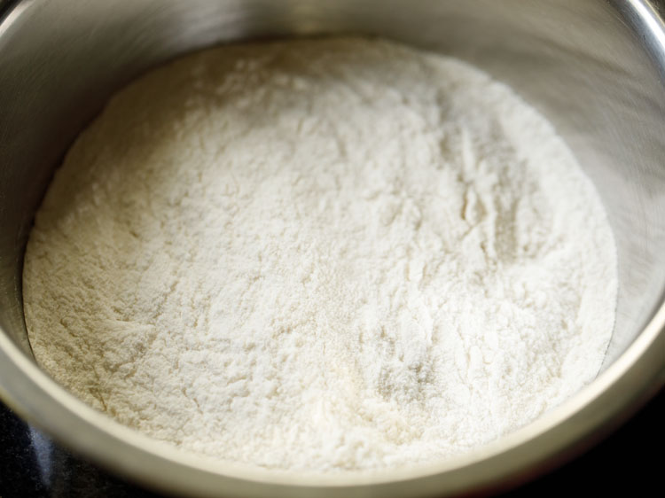 roasted rice flour added in a mixing bowl and kept aside. 