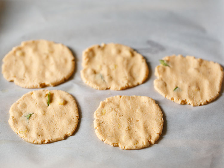 shaped thattai on greased parchment paper. 