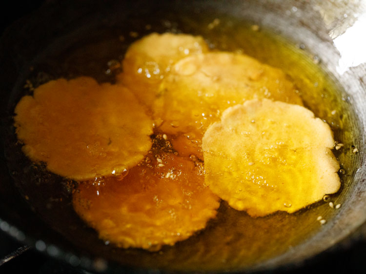 frying thattai rounds in oil. 