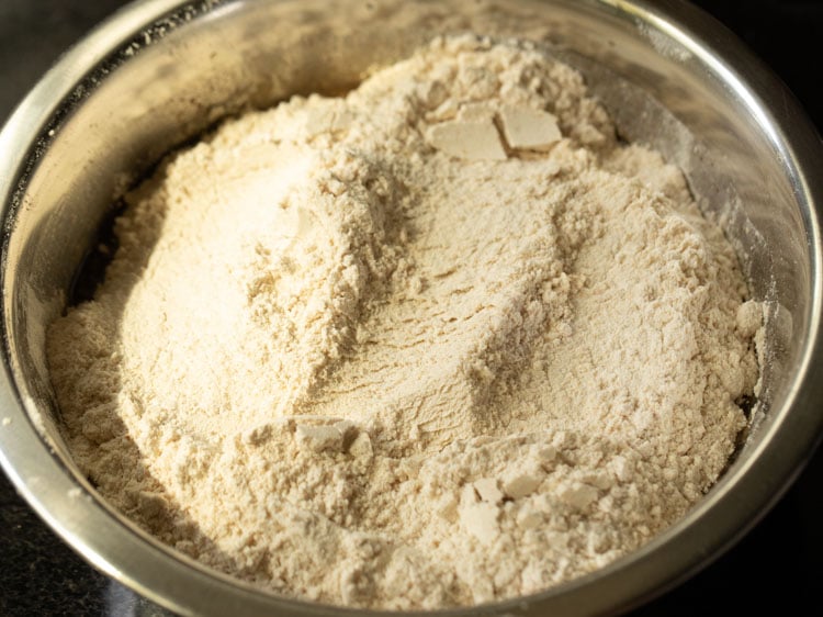 sifted dry ingredients on top of wet ingredients in the bowl.