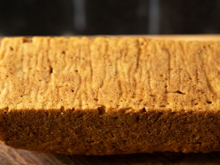 bottom of pumpkin bread after pulling off the parchment.