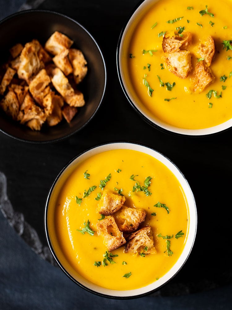 carrot soup served in bowls