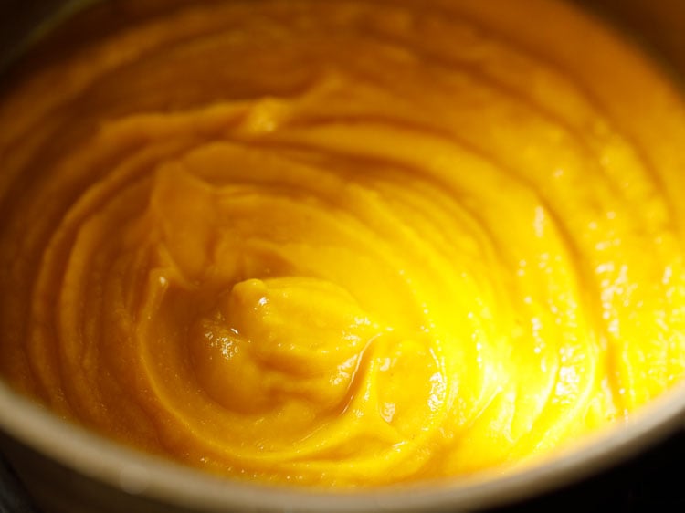 poured blended carrot soup puree in the pan or pot