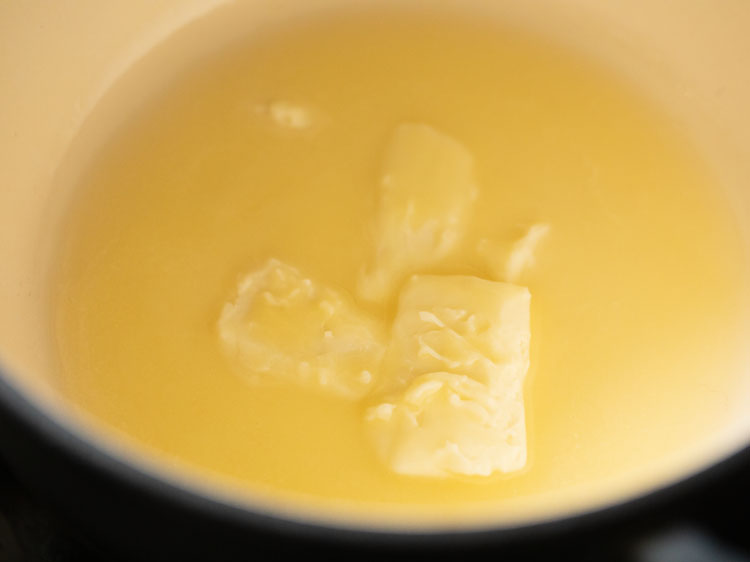 butter being melted in a pan.