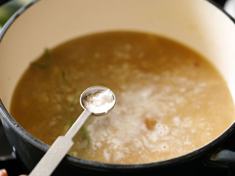 after 30 minutes of simmering, season french onion soup with salt.