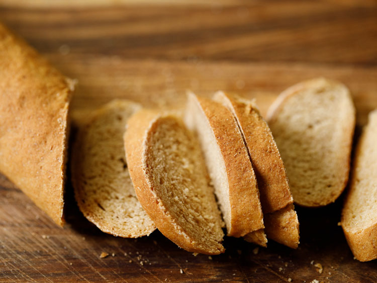 baguette being sliced.