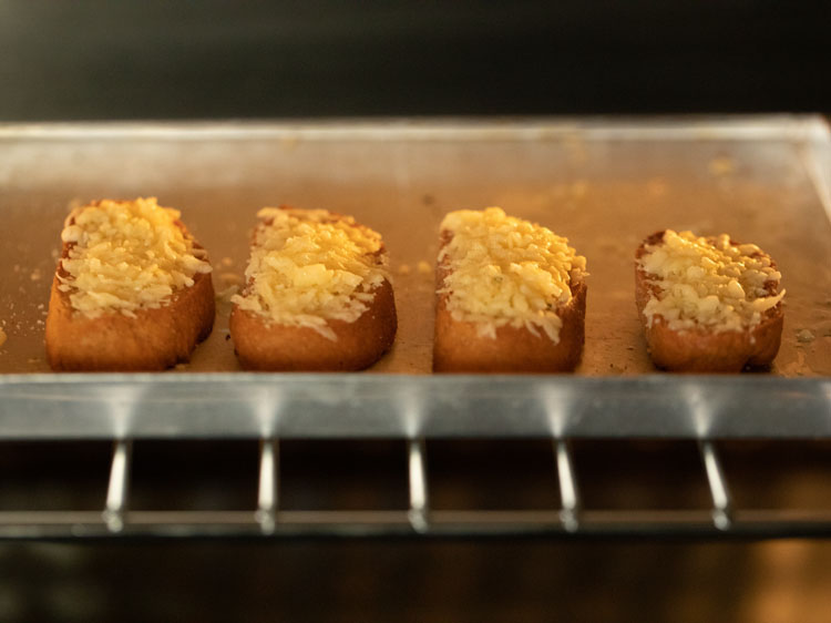 cheesy baguette slices in the oven.