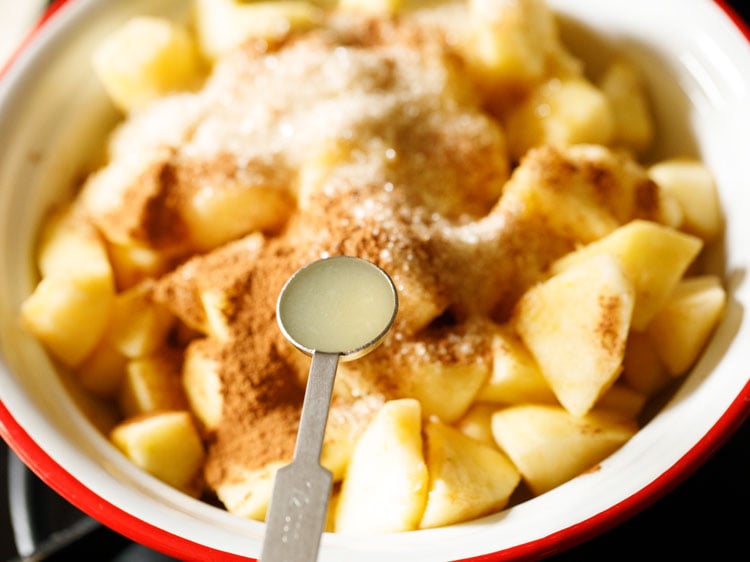 lemon juice being added to apple mix