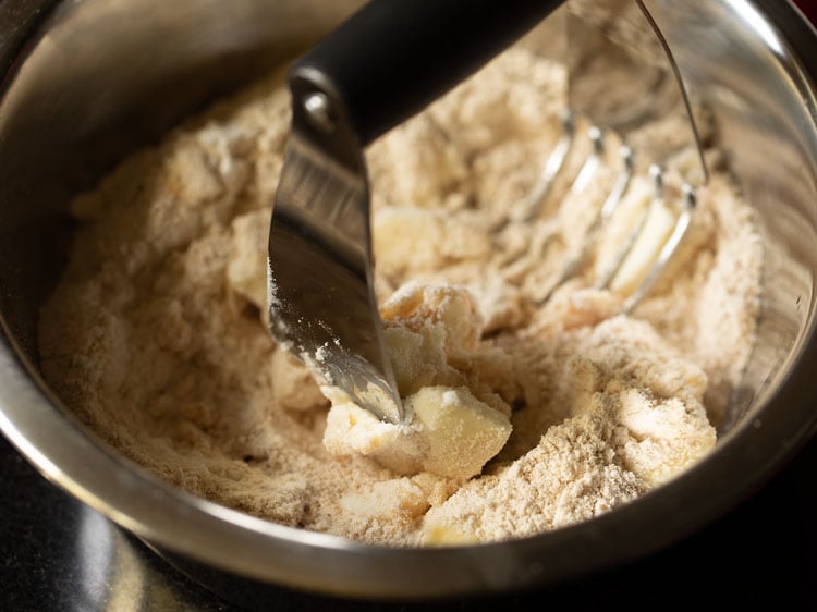 cutting butter in the flour with a pastry cutter