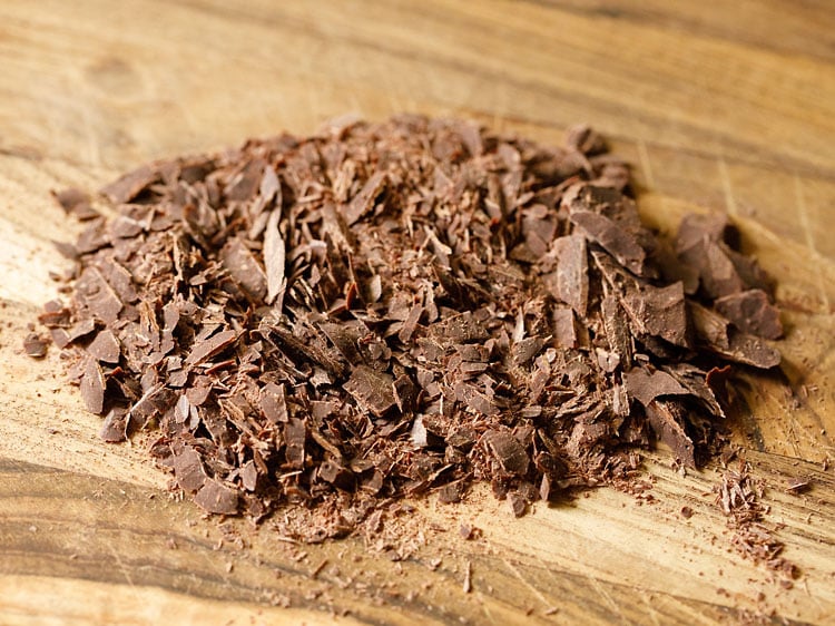 chopped chocolate on a wooden chopping board