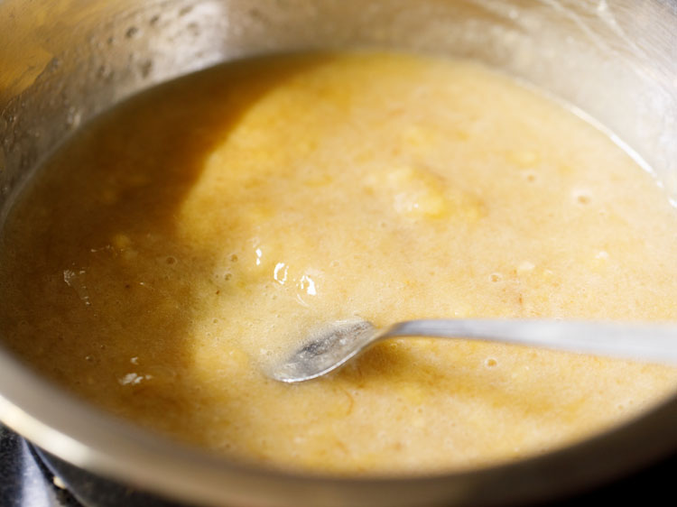 mashing bananas with a fork.